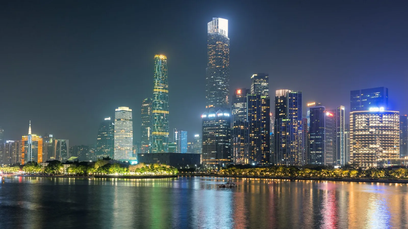 Illuminated Guangzhou skyline reflected in the Pearl River