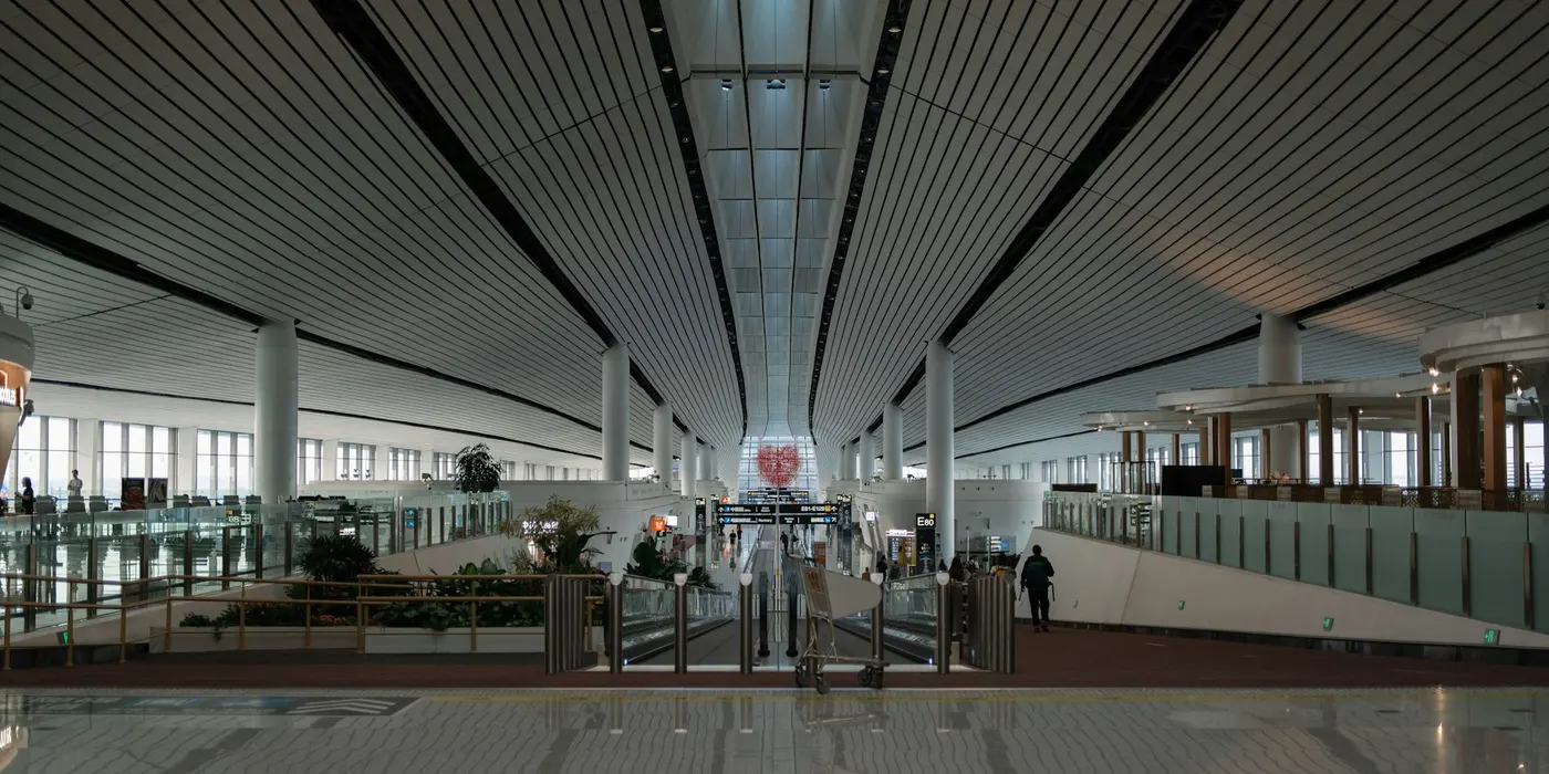 A concourse and airport signs at Beijing Daxing Airport